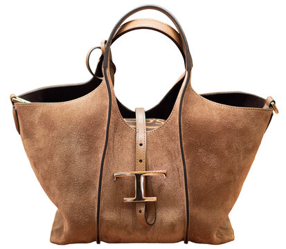 A practical Tod&rsquo;s T Timeless shopping bag in soft light brown suede, featuring a gold-tone metal logo on the fastening strap and top handles. Milan &ndash; Italy, 4 October 2026
