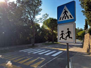 Pedestrian Crossing and School Zone Road Signs on Street © Vindigo+