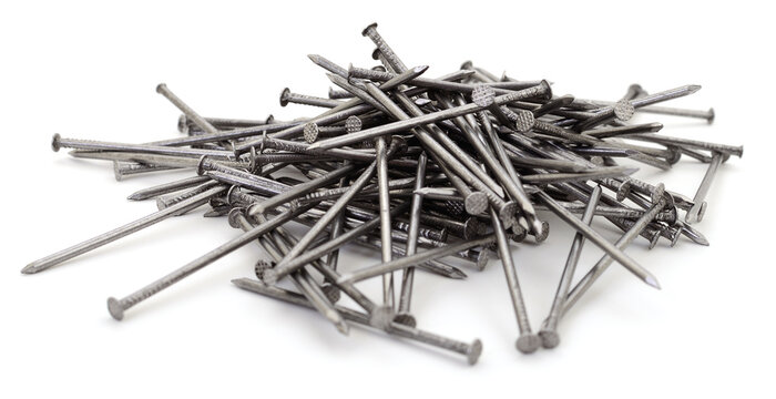 pile of metal construction nails isolated on white background