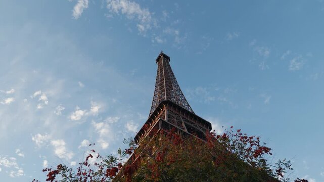 Low Angle Moving Shot of the Eiffel Tower with Autumn Trees, Paris