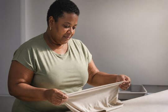 Textile Recycling Sorting - Sorter Checks Jersey Stretch for Fiber Grading