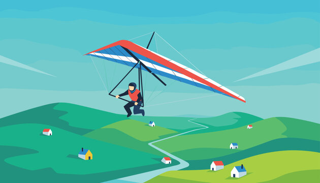 Adventurous man flies a red and blue hang glider high above green rolling hills dotted with tiny white houses.