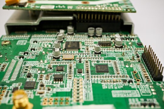 Green PCB Circuit Board with Electronic Components Close-Up
