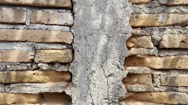 Close Up of Aged Brickwork and Damaged Concrete Cement Surface Texture