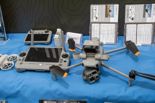 DJI Matrice 4T drone displayed with controller at technology trade show