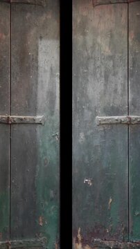 Old green wooden shutters opening with greenscreen