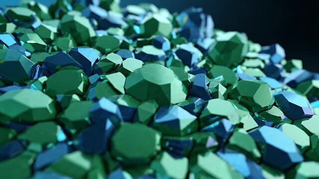 Abstract Green and Blue Geometric Crystals Background Animation - A close-up view of a pile of faceted geometric shapes in shades of green and blue, with a shallow depth of field.