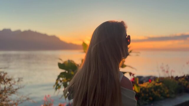 Young Blonde Woman Enjoying Sunset by Lake Geneva in Switzerland