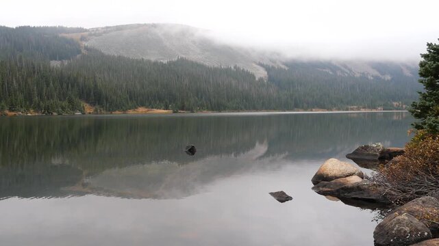 Long Lake Reflecting Mountains and Engelmann Spruce Forest Under Low Clouds in Colorado Rockies