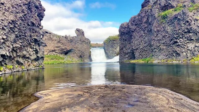 Scenic Double Waterfall Hj&aacute;lparfoss and Basalt Rocks in Iceland