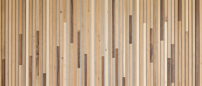 Wood slat wall background featuring mixed tone vertical panel pattern ideal for interior design and modern paneling projects