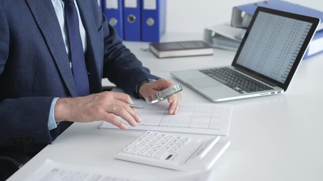 Professional auditor analyzing financial data, scrutinizing numbers and documents with a magnifying glass, performing detailed accounting and business analytics in an office setting