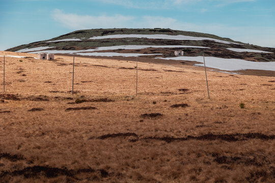 Subalpine tundra landscape in the Giant Mountains with melting snow fields in spring