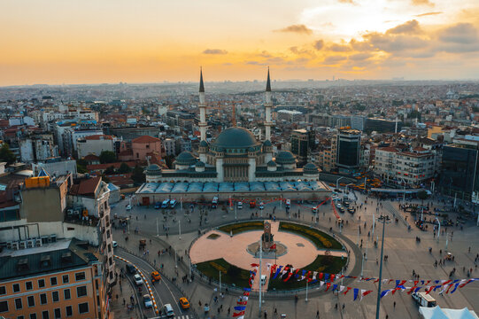 Taksim Square and taksim mosque appear in an aerial drone view of Istanbul. The cityscape highlights the landmark mosque and surrounding urban area.