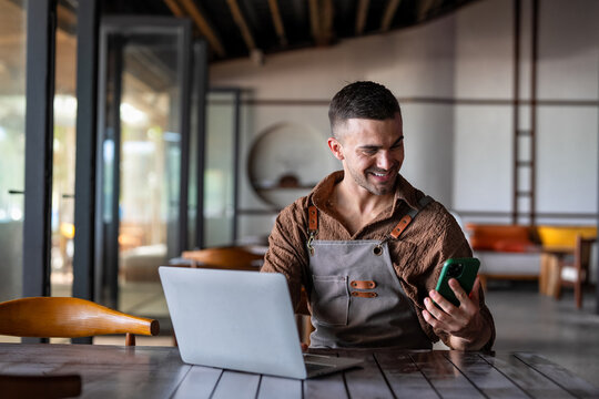Man waiter with tablet in restaurant for a successful operation with digital tools, smart management