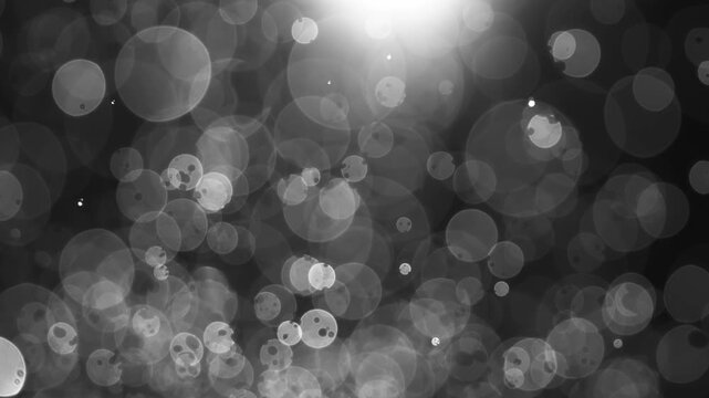 Floating abstract particle bokeh on dark background. Shot on super slow motion camera 1000 fps.