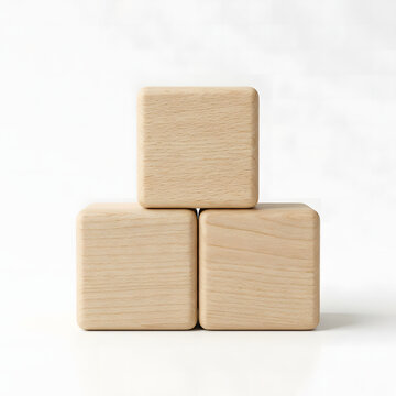 Three blank wooden toy blocks stacked neatly together against a bright clean studio background