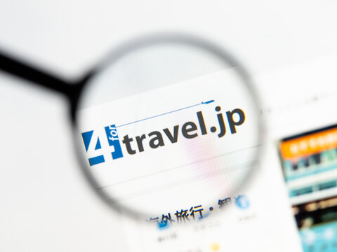 Milan, Italy 2026, 15 AGO Closeup of 4travel jp website page on a laptop screen. Focus on 4travel jp logo under a magnifying glass.
