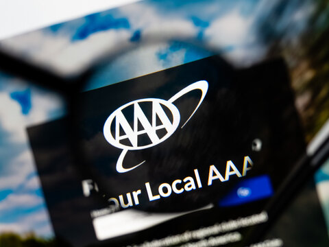 Milan, Italy 2026, 15 AGO Closeup of aaa com website page on a laptop screen. Focus on aaa com logo under a magnifying glass.