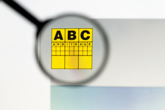 Milan, Italy 2026, 15 AGO Closeup of ABC Arbitrage website page on a laptop screen. Focus on ABC Arbitrage logo under a magnifying glass.