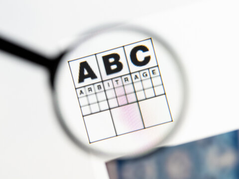 Milan, Italy 2026, 15 AGO Closeup of ABC Arbitrage website page on a laptop screen. Focus on ABC Arbitrage logo under a magnifying glass.
