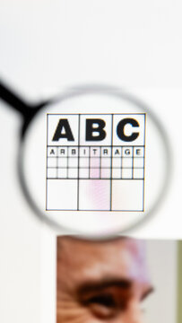 Milan, Italy 2026, 15 AGO Closeup of ABC Arbitrage website page on a laptop screen. Focus on ABC Arbitrage logo under a magnifying glass.