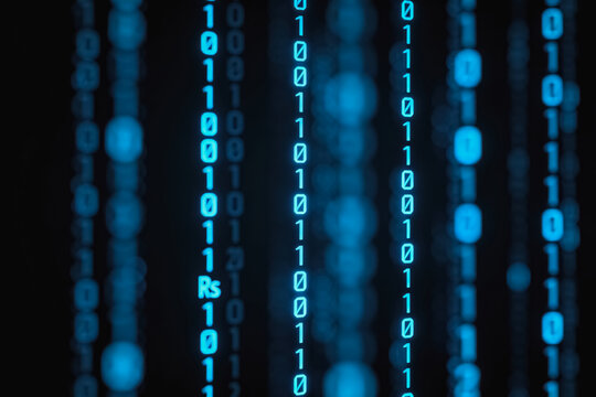 Glowing binary code streams against dark background, representing digital data and modern information technology.