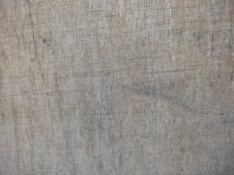 Old rustic wooden board surface with faint cracks and scratches