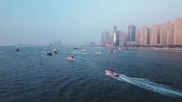 UAE, DUBAI, December 11, 2025: Dubai Marina skyline and luxury yachts in the sea at sunrise