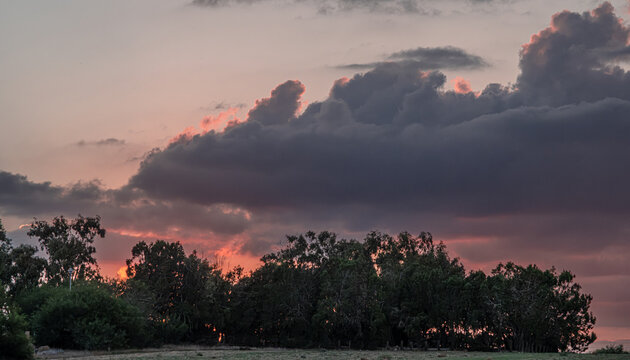 Sunset view with dark cloudy sky, as seen from Faros Beach by the sea in Pervolia village, Larnaka District, Cyprus