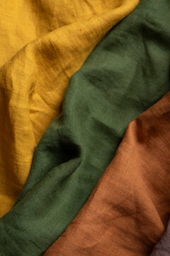 Close-up macro photograph of softly draped natural linen fabrics