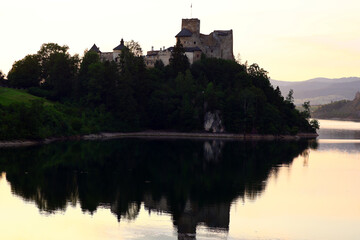 Medieval Niedzica Castle on Hill over Lake at Sunset, Poland © JAROSLAW PIWOWARSKI