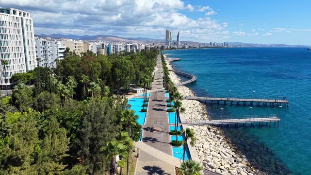 Aerial drone view of Molos promenade, seaside park, and walking piers in Limassol waterfront, Cyprus.