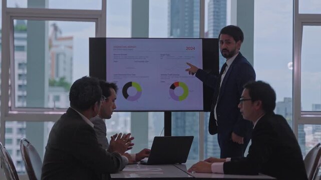 Business meeting office presentation with male presenter, business person and colleague team corporate conference room, reviewing chart and data during office discussion, financial collaboration