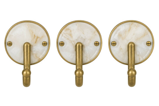 Three decorative brass wall hooks with white marble circular backplates on a white background