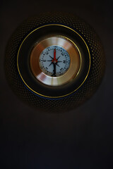 Close-Up of Vintage Compass with Atmospheric Lighting for Navigation and Exploration Themes © alexkich