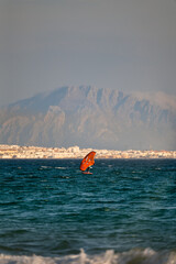 Wing foiler in Tarifa with African mountain background © Paolo Corazza