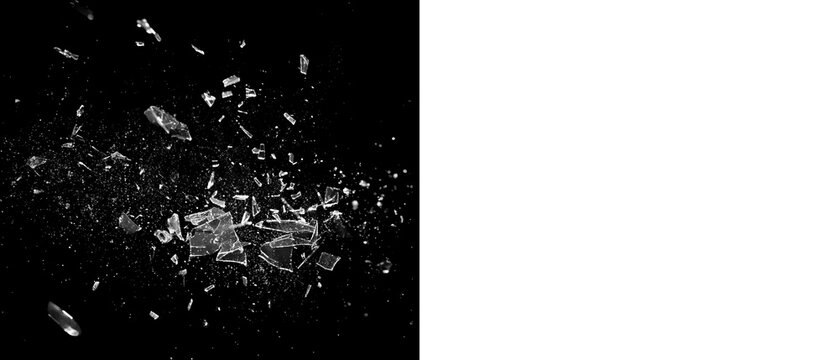 Glass shattering explosion with flying fragments and scattered shards, dramatic high contrast breaking glass effect on black background for action scenes, transitions and overlays