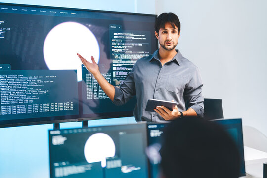Adult latin engineer programmer presentation coding AI artificial intelligence algorithm coder training monitor developer expertise programming IT technology career