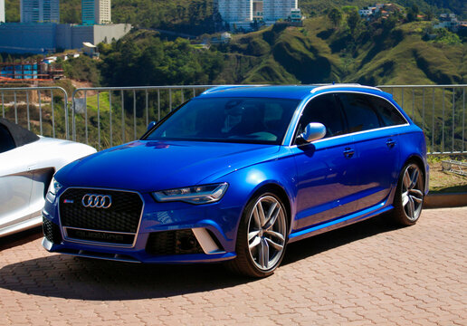 Blue Audi RS6 Avant Performance Wagon Front Three-Quarter View Parked on Mountain Scenic Overlook