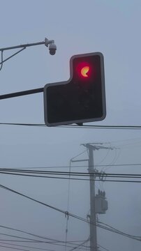 Red Traffic Light on Pole Against Urban Background