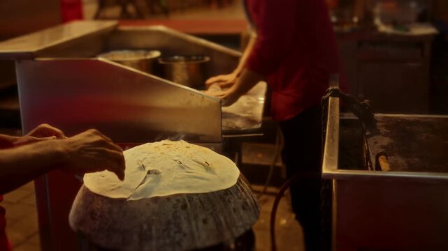 Traditional Indian Rumali Roti Bread Cooking on Hot Tawa
