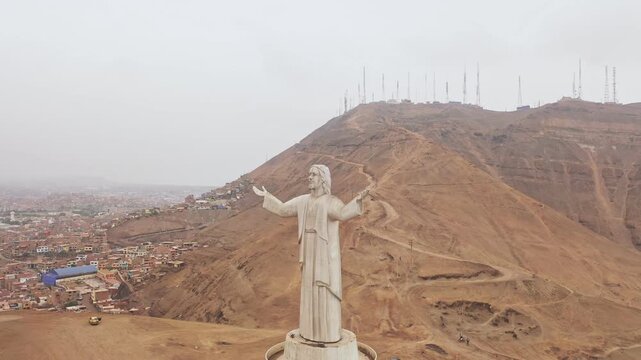 Aerial view of the christ of the pacific monument on morro solar hill in chorrillos, lima, peru
