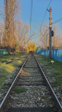 Warmly Illuminated Railway Tunnel with Curving Tracks