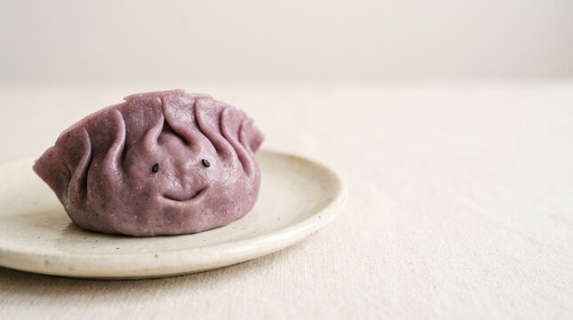 Cute purple dumpling on a ceramic plate with a smiling face
