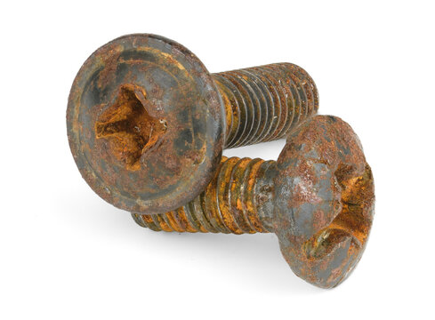 Assortment of weathered metal bolts displaying various drive head types and recess sizes