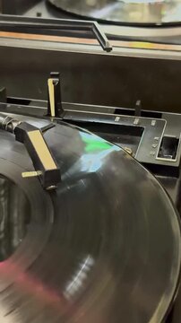 Close-Up of a Vinyl Record Spinning on a Turntable