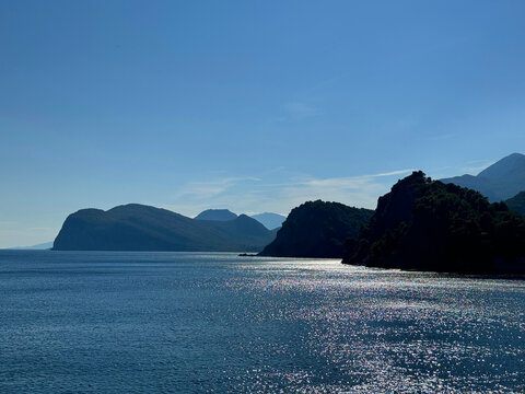 Sea blue shiny waters and rocky coastline Mediterranean
