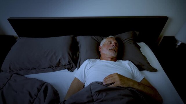 Mature adult sleeping at night