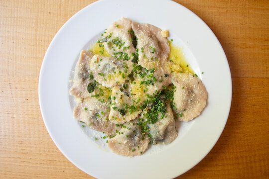 Schlutzkrapfen are half-moon-shaped pasta parcels made from rye dough and filled with spinach and ricotta&mdash;a specialty of South Tyrol.